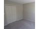 Spacious bedroom featuring neutral carpet and a double door closet at 2401 Northlake Ct, Atlanta, GA 30345