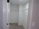 Walk-in closet boasts installed shelving, offering ample storage at 2401 Northlake Ct, Atlanta, GA 30345