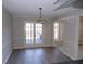 Dining room with new flooring and french doors leading to the outdoor deck at 2401 Northlake Ct, Atlanta, GA 30345