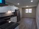 Kitchen features stainless steel appliances, white cabinets, granite countertops, and updated flooring at 2401 Northlake Ct, Atlanta, GA 30345