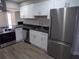 Spacious kitchen featuring stainless steel appliances and views of the living room at 2401 Northlake Ct, Atlanta, GA 30345
