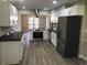 Modern kitchen features granite countertops, stainless appliances, and wood-look flooring at 2401 Northlake Ct, Atlanta, GA 30345