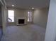 Living room with neutral carpet, large windows, and a traditional painted brick fireplace at 2401 Northlake Ct, Atlanta, GA 30345