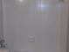 Close-up of a pristine white tiled shower featuring a built-in soap dish at 2401 Northlake Ct, Atlanta, GA 30345