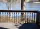 View from the wood deck with a brown wood rail and wrought iron fence overlooking the lake at 2401 Northlake Ct, Atlanta, GA 30345