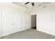 Spacious bedroom with neutral carpet, closet, tray ceiling, and ceiling fan at 2881 Peachtree Ne Rd # 702, Atlanta, GA 30305