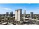 Tall, modern condominium building featuring balconies and city views from a high vantage point at 2881 Peachtree Ne Rd # 702, Atlanta, GA 30305
