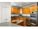 Elegant kitchen featuring granite countertops, stainless steel appliances, and light wood cabinetry at 2881 Peachtree Ne Rd # 702, Atlanta, GA 30305