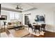 Open concept living room with a cozy seating area and dining space, perfect for entertaining at 2881 Peachtree Ne Rd # 702, Atlanta, GA 30305