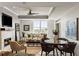 Inviting living room featuring a fireplace, ceiling fan, and lots of natural light at 2881 Peachtree Ne Rd # 702, Atlanta, GA 30305