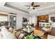 Open concept living space with a view of the kitchen and access to the balcony at 2881 Peachtree Ne Rd # 702, Atlanta, GA 30305