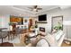 Open concept living space with a fireplace, kitchen view, and comfortable seating at 2881 Peachtree Ne Rd # 702, Atlanta, GA 30305