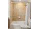 Bathroom with a tile shower, white shower curtain, and a white toilet at 2881 Peachtree Ne Rd # 702, Atlanta, GA 30305