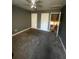 Bedroom with two closets, an open doorway, and wall to wall carpet at 405 Fairburn Sw Rd, Atlanta, GA 30331