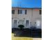A townhouse exterior with a yard, window, and visible entryway at 405 Fairburn Sw Rd, Atlanta, GA 30331