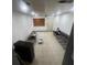 An open-concept living area with tile floors and bright recessed lighting at 405 Fairburn Sw Rd, Atlanta, GA 30331