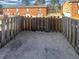 Enclosed backyard featuring a concrete patio, a wooden fence and a view of a brick building at 5676 Kingsport Dr # 4, Atlanta, GA 30342