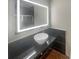 Well-lit bathroom featuring under-mount sink and sleek countertop at 5676 Kingsport Dr # 4, Atlanta, GA 30342