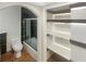 Updated bathroom featuring tiled shower, new toilet, and custom shelving at 5676 Kingsport Dr # 4, Atlanta, GA 30342