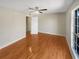 Inviting bedroom featuring hardwood floors, ceiling fan, and ample natural light at 5676 Kingsport Dr # 4, Atlanta, GA 30342