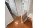 Hallway with hardwood floors and view into the bedroom and bathroom at 5676 Kingsport Dr # 4, Atlanta, GA 30342