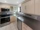 Modern kitchen with stainless steel appliances, light wood cabinets, and stylish countertops at 5676 Kingsport Dr # 4, Atlanta, GA 30342