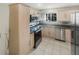 Bright kitchen featuring stainless steel appliances, tiled floor and plentiful storage at 5676 Kingsport Dr # 4, Atlanta, GA 30342
