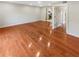 Spacious living room featuring gleaming hardwood floors and an open layout at 5676 Kingsport Dr # 4, Atlanta, GA 30342