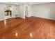 Spacious living room with hardwood floors and open access to the kitchen at 5676 Kingsport Dr # 4, Atlanta, GA 30342