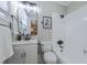 Bathroom featuring an all-white design, framed mirror, and chrome fixtures at 1532 Pineview Sw Ter, Atlanta, GA 30311