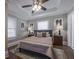 Cozy bedroom featuring a ceiling fan, neutral walls, and bright natural light at 1532 Pineview Sw Ter, Atlanta, GA 30311