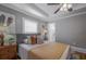 Charming bedroom with a ceiling fan, neutral walls, and bright natural light at 1532 Pineview Sw Ter, Atlanta, GA 30311