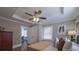 Charming bedroom featuring a ceiling fan, neutral walls, and plenty of natural light from the window at 1532 Pineview Sw Ter, Atlanta, GA 30311