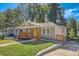 View of a charming home with a quaint front porch, showcasing curb appeal at 1532 Pineview Sw Ter, Atlanta, GA 30311