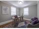 Bright home office with two windows, a modern desk, and two chairs at 1532 Pineview Sw Ter, Atlanta, GA 30311