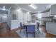 Stylish kitchen with white cabinets, stainless steel appliances, and a dining area at 1532 Pineview Sw Ter, Atlanta, GA 30311