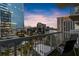 Balcony with chairs overlooking a vibrant city skyline at dusk, perfect for relaxing and enjoying urban views at 3324 Peachtree Ne Rd # 1115, Atlanta, GA 30326