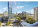 Balcony with a scenic view of the city skyline, showcasing modern architecture and lush greenery on a clear day at 3324 Peachtree Ne Rd # 1115, Atlanta, GA 30326