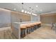 Stylish bar area featuring a long counter with seating, decorative lighting, and modern design elements at 3324 Peachtree Ne Rd # 1115, Atlanta, GA 30326