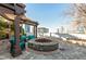 Outdoor fire pit area with pergola and comfortable seating at 3324 Peachtree Ne Rd # 1115, Atlanta, GA 30326