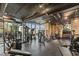 Well-equipped gym featuring various weight machines, free weights, and a spiral staircase, perfect for fitness enthusiasts at 3324 Peachtree Ne Rd # 1115, Atlanta, GA 30326