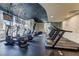 Modern gym with treadmills, ellipticals, and TVs for entertainment, providing a convenient and motivating workout space at 3324 Peachtree Ne Rd # 1115, Atlanta, GA 30326