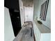 Hallway with modern lighting, art, and hardwood floors at 3324 Peachtree Ne Rd # 1115, Atlanta, GA 30326
