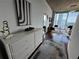 Hallway view leading into living area with city views and modern decor at 3324 Peachtree Ne Rd # 1115, Atlanta, GA 30326
