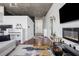 Stylish modern interior features hardwood floors, an electric fireplace, and a view through large windows at 3324 Peachtree Ne Rd # 1115, Atlanta, GA 30326