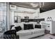 Stylish living room with modern kitchen featuring stainless steel appliances and black subway tile at 3324 Peachtree Ne Rd # 1115, Atlanta, GA 30326