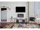 Modern living room showcasing a flatscreen TV, electric fireplace, and stylish gold accent furniture at 3324 Peachtree Ne Rd # 1115, Atlanta, GA 30326