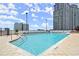 Beautiful rooftop pool featuring lounge chairs and stunning city views at 3324 Peachtree Ne Rd # 1115, Atlanta, GA 30326