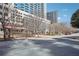 Street view of condos with restaurant on street level and high rise in background at 3324 Peachtree Ne Rd # 1115, Atlanta, GA 30326