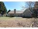 Expansive backyard featuring a lush green lawn, mature trees, and fenced perimeter at 67 Mossy Oak Ln, Dallas, GA 30157